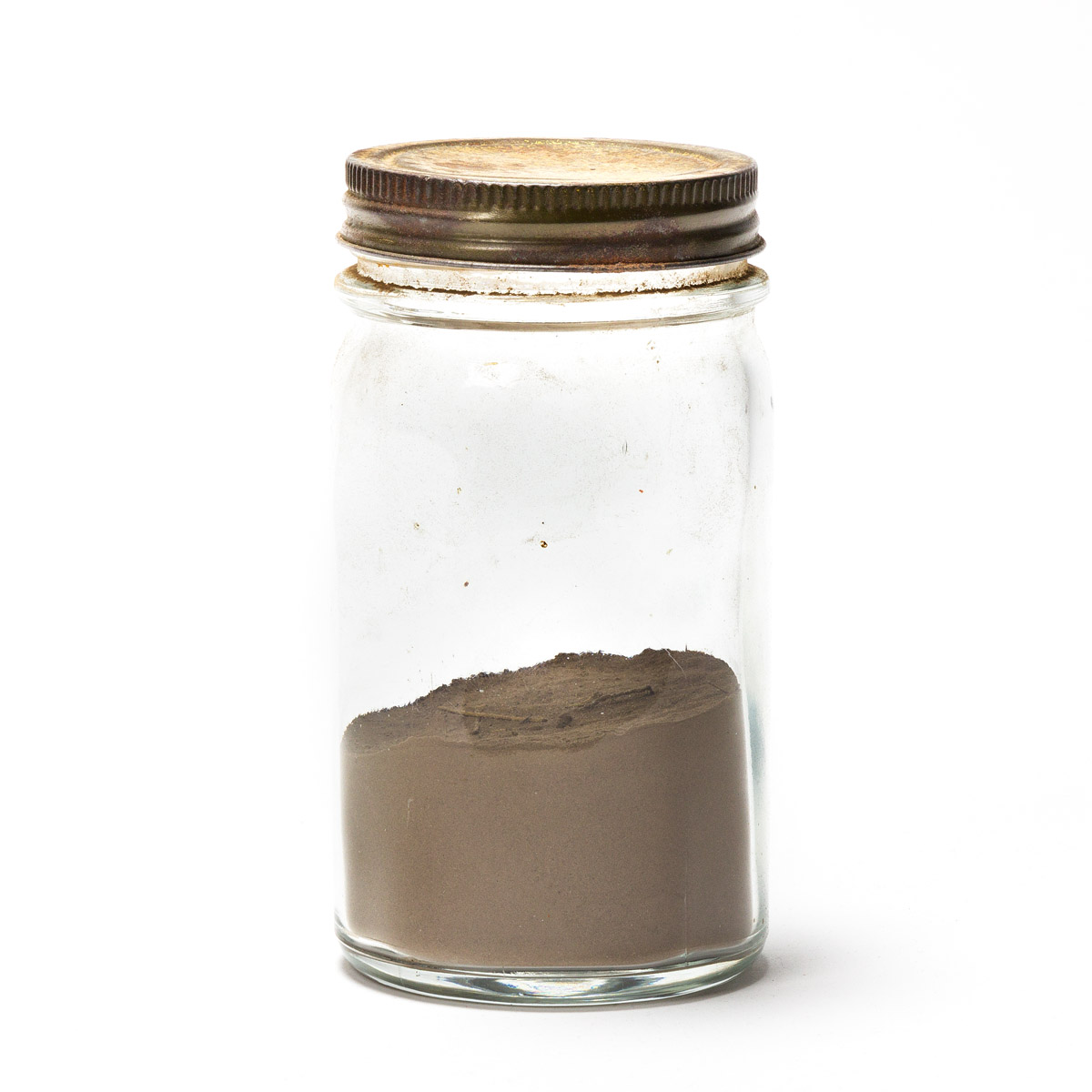 (WEST--KANSAS.) Jar of dust gathered in Kansas during the Dust Bowl, with note.